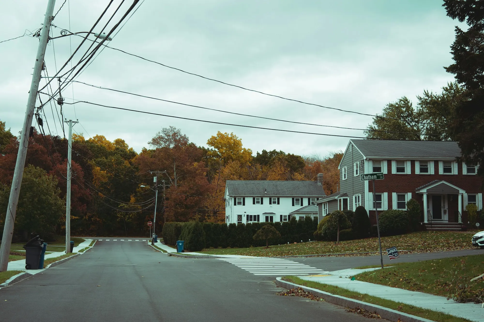 Residential street with houses and overhead lines